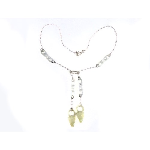 Early 20th century celadon jade, white enamel and diamond necklace